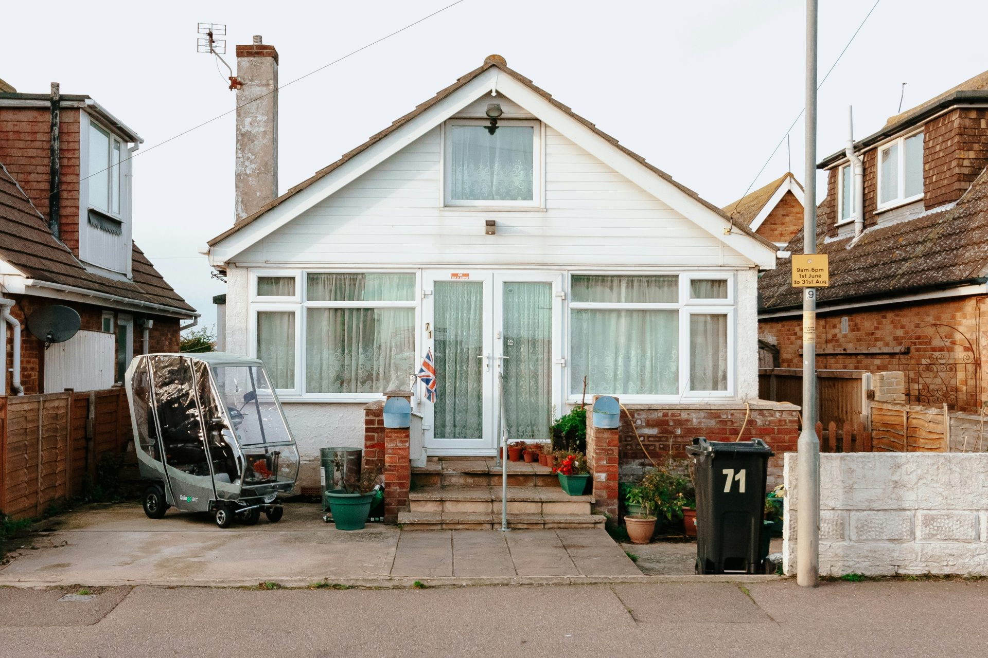A house with a car parked in front of it